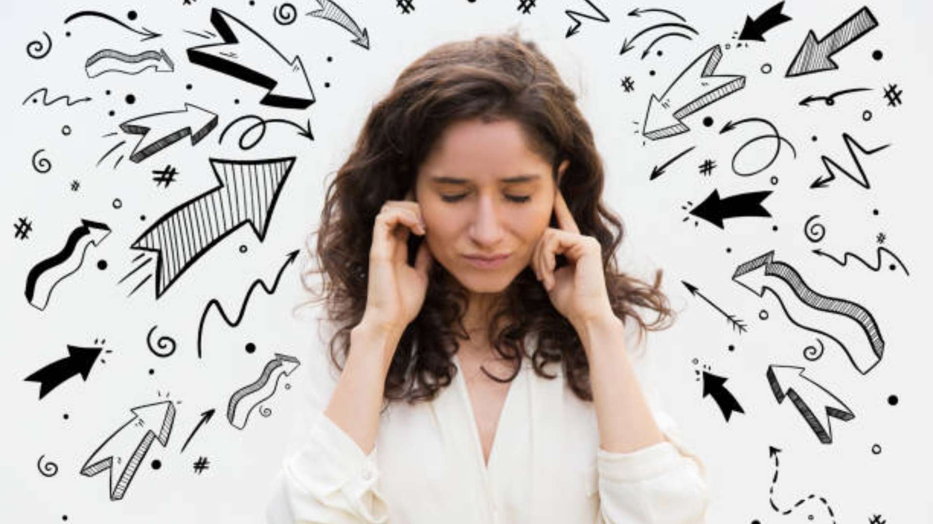 A woman seated cross-legged in a softly lit room, eyes closed, surrounded by symbols representing the elements—water, fire, and a bird—symbolizing sensory grounding.