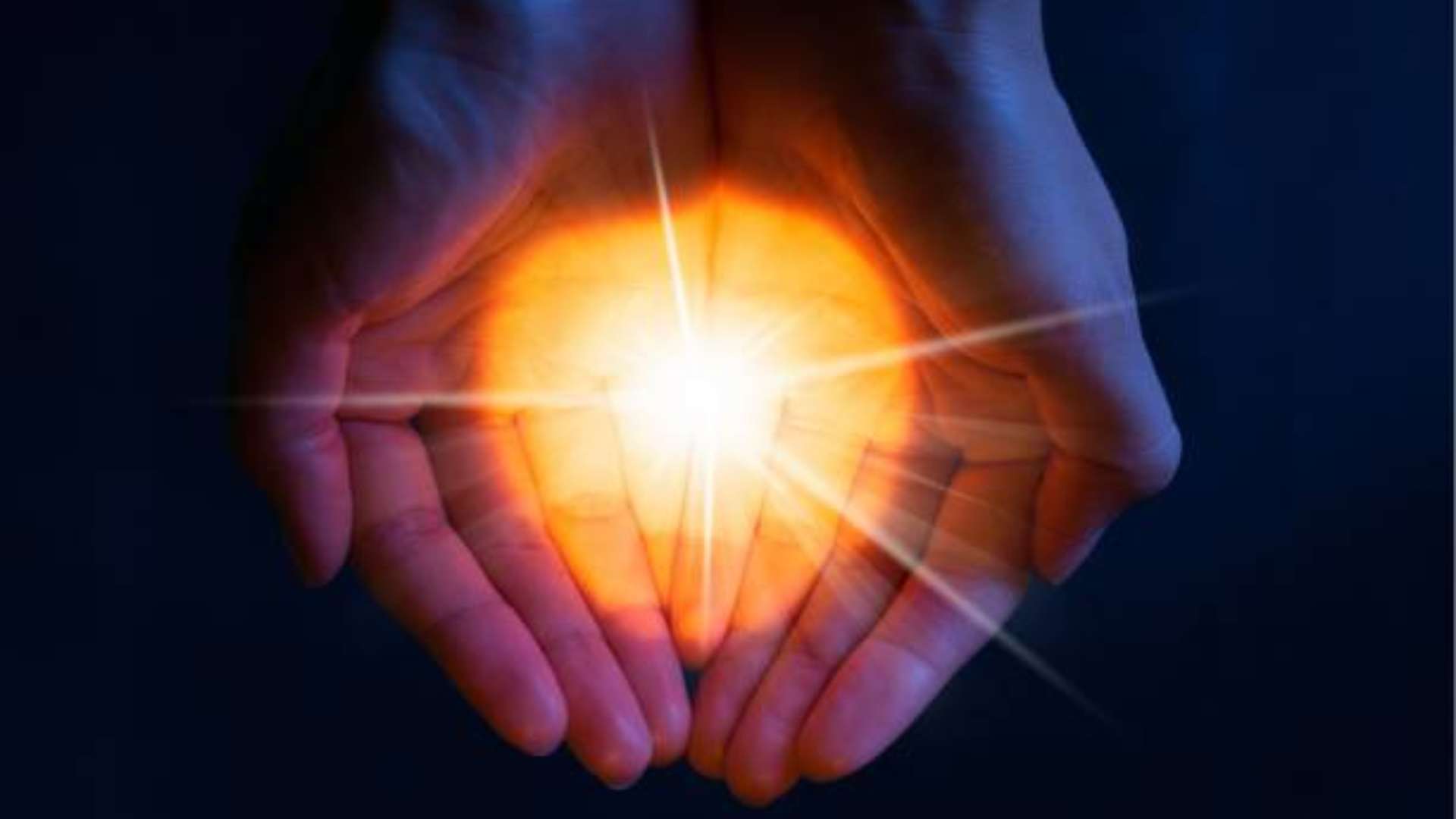Person holding a lantern at twilight, symbolizing healing through grief