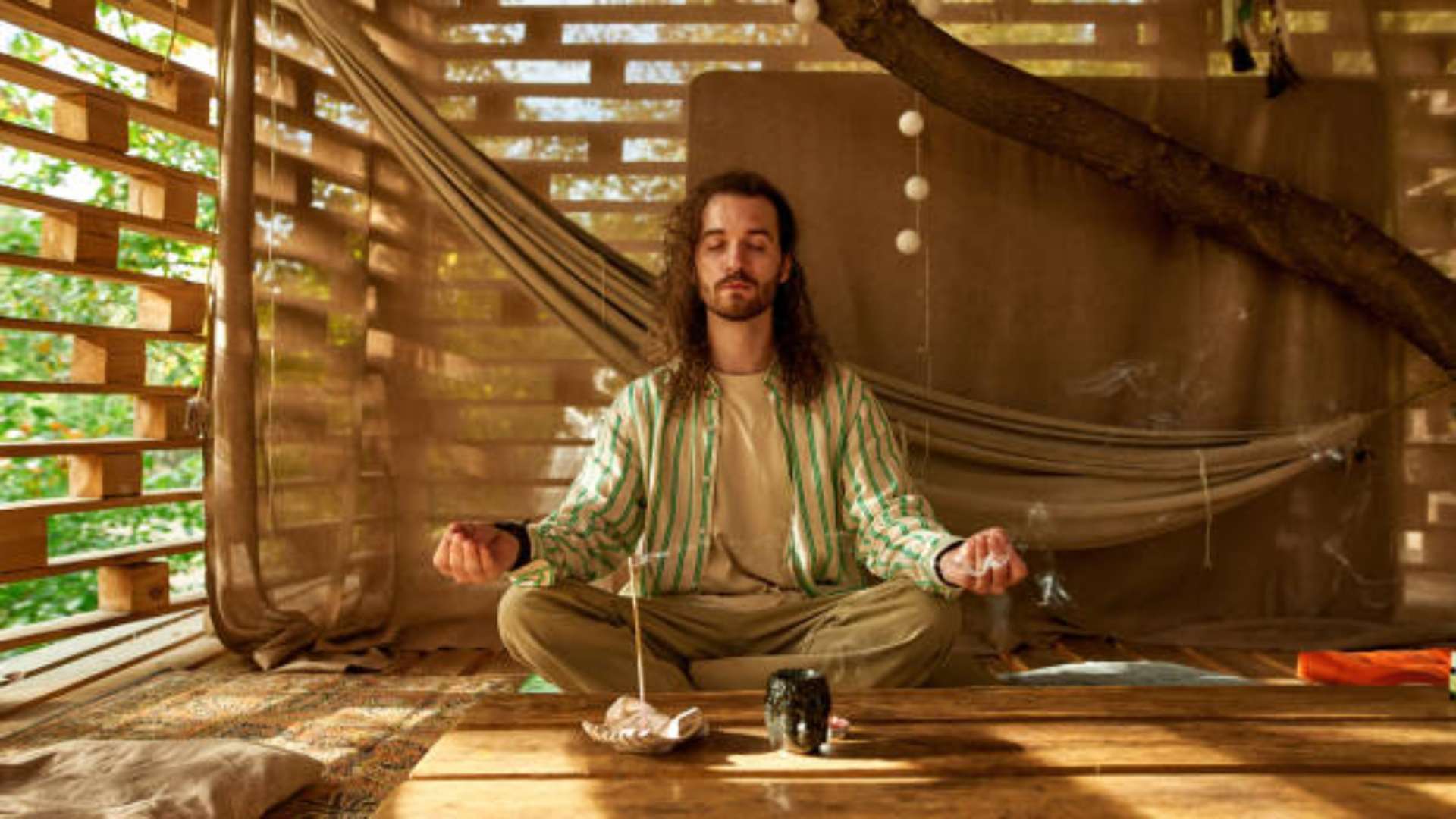 Serene woman practicing a short meditation with soft lighting and relaxed posture
