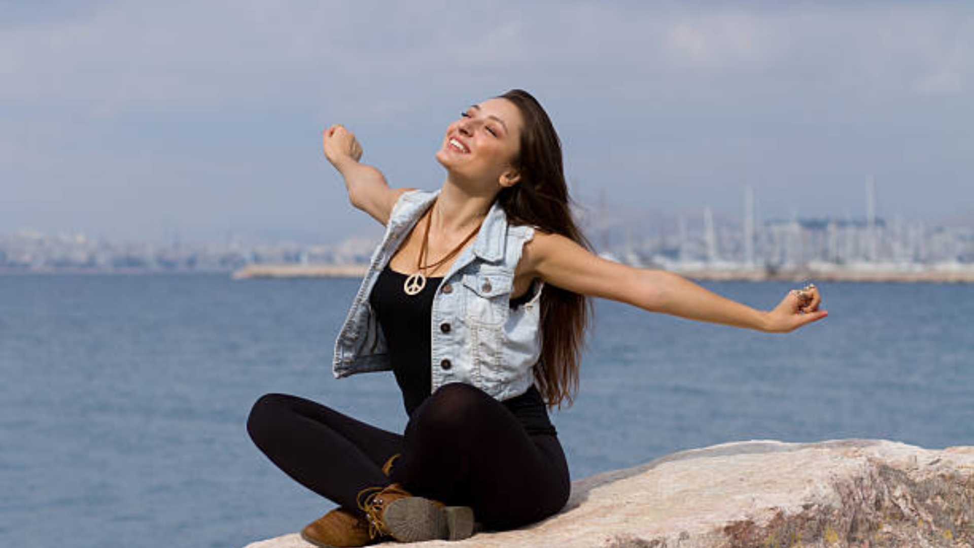 Person enjoying a warm cup of tea on a peaceful porch, representing a daily joy ritual
