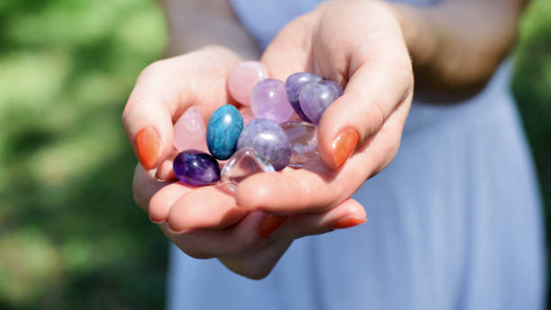 Beginner holding healing crystals in natural light