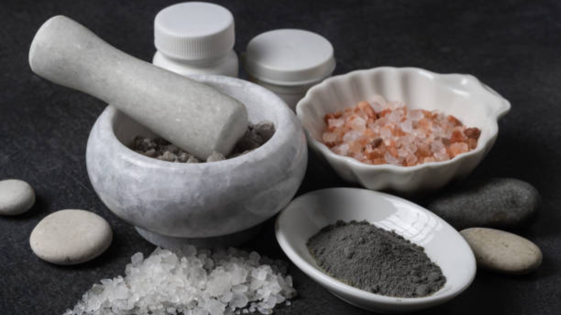 Healing mineral bath setup with Himalayan salt, Dead Sea salt, and candles