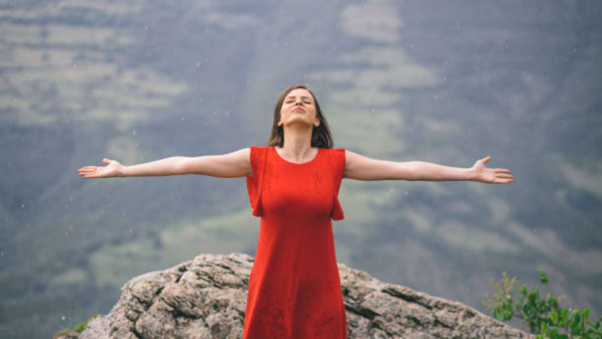 Person calmly navigating through stormy emotional weather with grace and resilience.